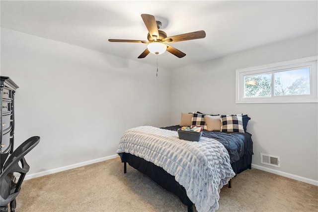 bedroom featuring light carpet and ceiling fan