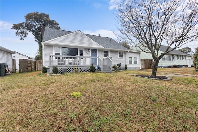 single story home with a wooden deck and a front lawn