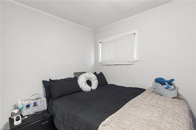 bedroom featuring crown molding