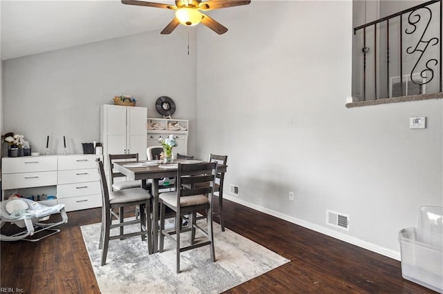 dining room featuring ceiling fan, vaulted ceiling, and dark hardwood / wood-style flooring