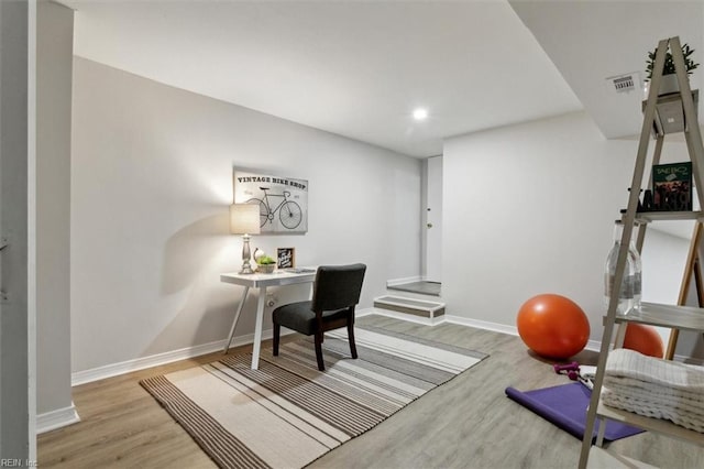 home office featuring light hardwood / wood-style floors