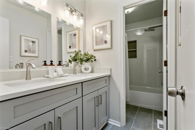 bathroom featuring shower / bathtub combination with curtain, vanity, and tile patterned floors