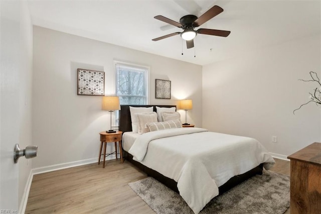 bedroom featuring ceiling fan and light hardwood / wood-style flooring