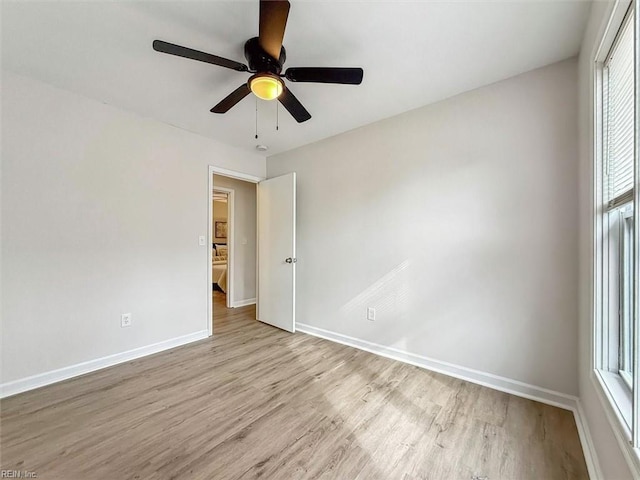 spare room featuring ceiling fan and light hardwood / wood-style floors