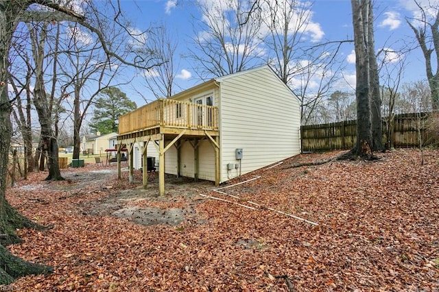 back of property featuring a wooden deck