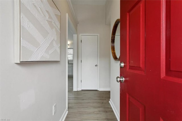 hallway with light hardwood / wood-style flooring