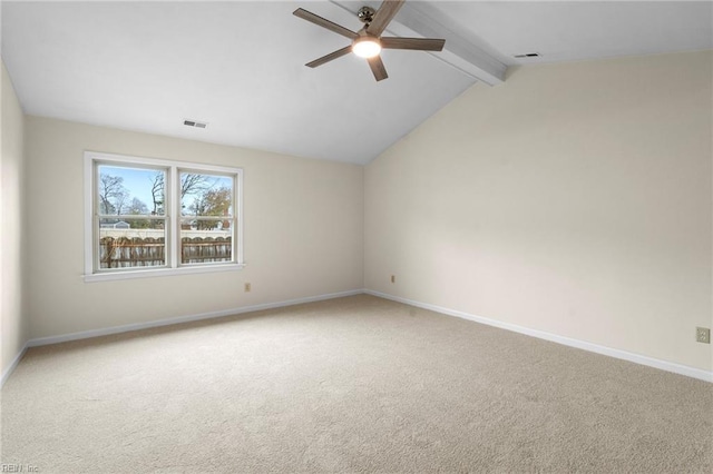 carpeted spare room featuring lofted ceiling with beams and ceiling fan