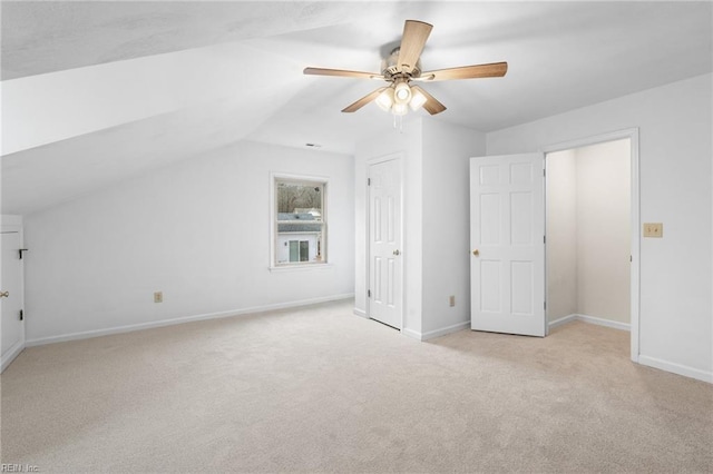 bonus room with ceiling fan, light colored carpet, and lofted ceiling