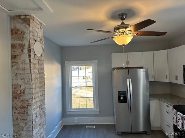 kitchen featuring dark wood-type flooring, light stone counters, tasteful backsplash, stainless steel fridge with ice dispenser, and white cabinets