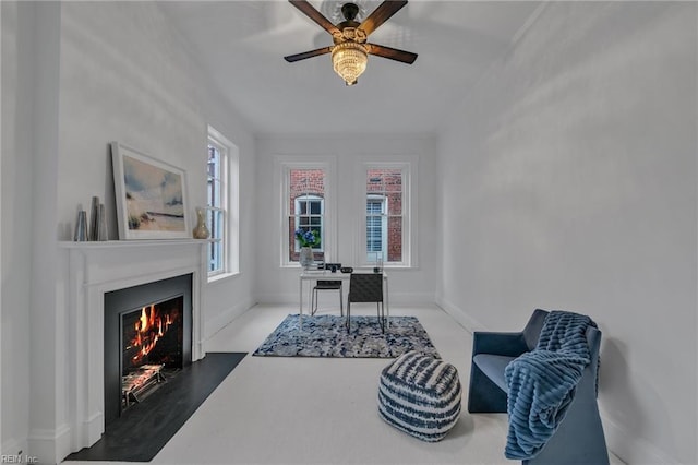 sitting room featuring ceiling fan