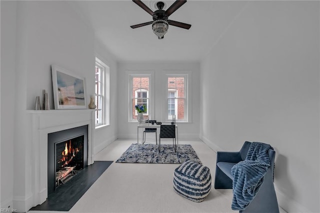 sitting room featuring ceiling fan