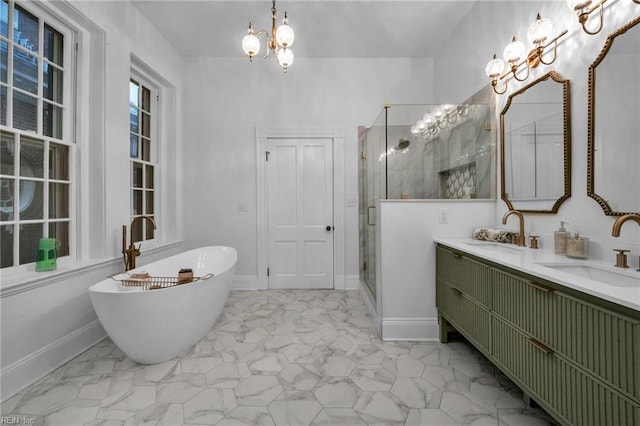 bathroom featuring independent shower and bath, vanity, and a notable chandelier