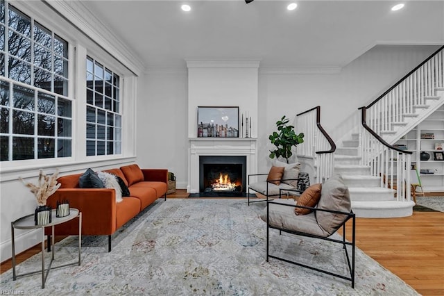 living room featuring ornamental molding and hardwood / wood-style floors