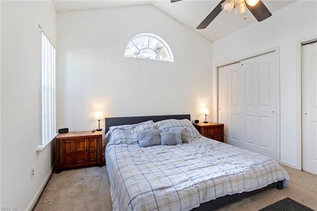 carpeted bedroom featuring ceiling fan and lofted ceiling