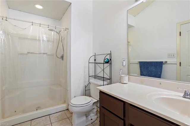 bathroom with walk in shower, vanity, toilet, and tile patterned flooring