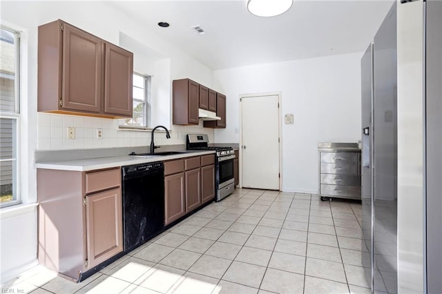 kitchen with sink, light tile patterned floors, stainless steel range with gas cooktop, black dishwasher, and backsplash