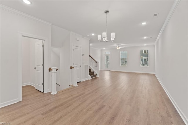 unfurnished living room with ornamental molding, ceiling fan with notable chandelier, and light wood-type flooring