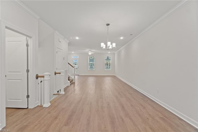 interior space featuring an inviting chandelier, ornamental molding, and light wood-type flooring