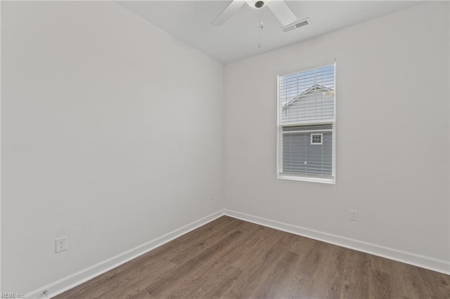 empty room with ceiling fan and hardwood / wood-style floors