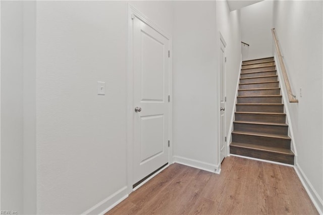 stairs with wood-type flooring