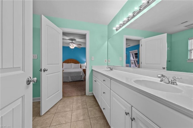 bathroom with ceiling fan, tile patterned floors, and vanity