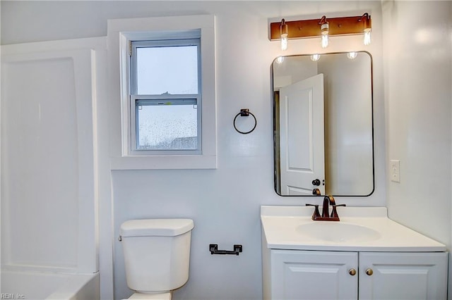 bathroom featuring vanity and toilet