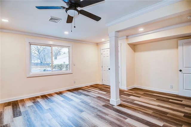 basement featuring ceiling fan, ornamental molding, and hardwood / wood-style floors