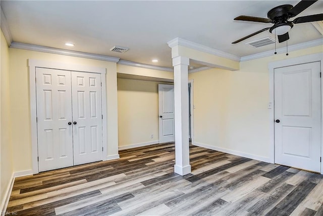 basement featuring crown molding, ceiling fan, and hardwood / wood-style flooring