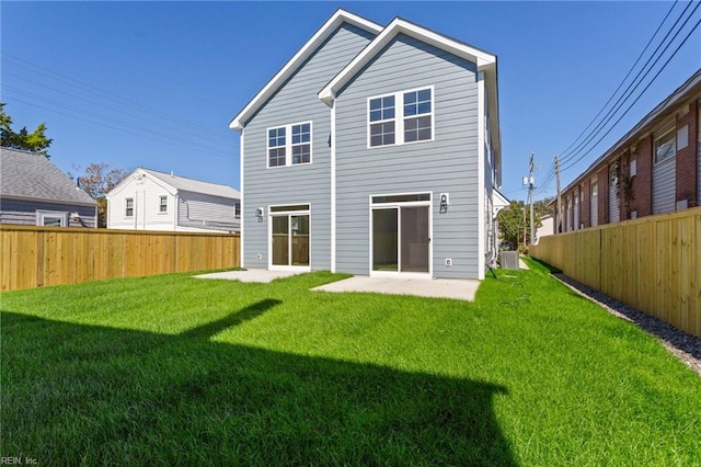 back of house featuring a yard, a patio, and central air condition unit