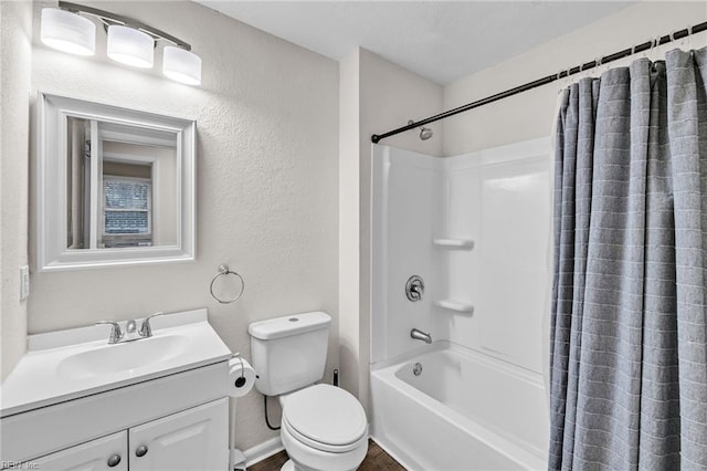 full bathroom featuring shower / bath combination with curtain, vanity, and toilet