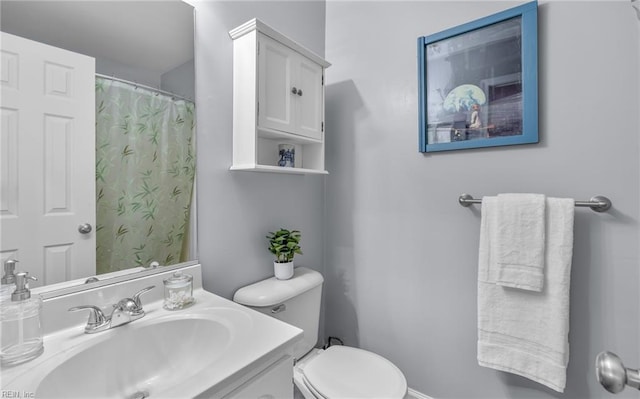 bathroom with vanity and toilet