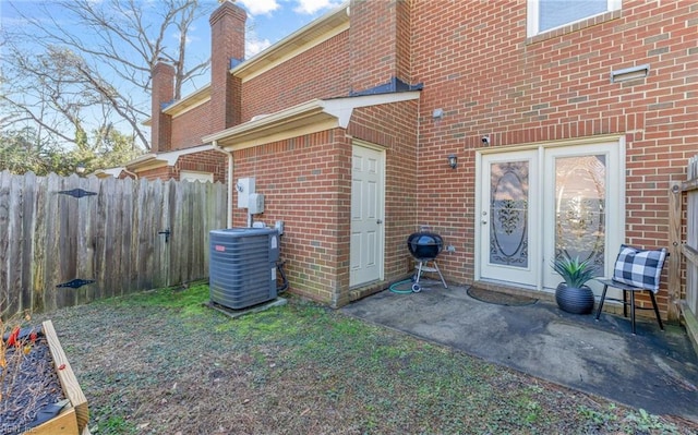 doorway to property with central air condition unit