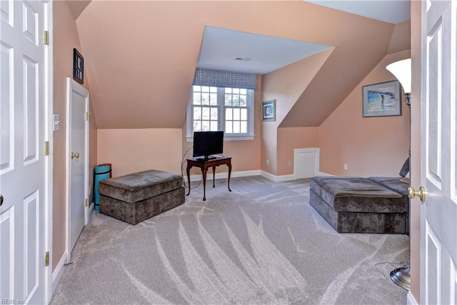 interior space with lofted ceiling and carpet floors