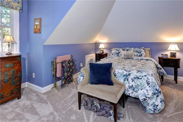 carpeted bedroom featuring vaulted ceiling