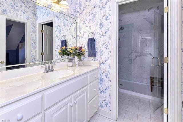 bathroom featuring vanity and a shower with shower door