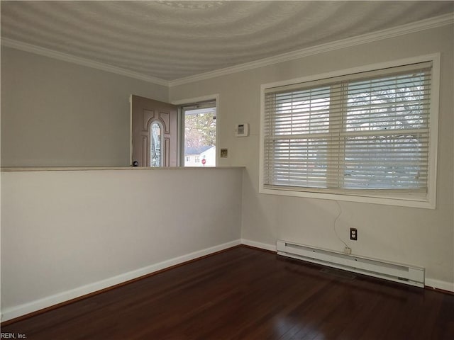 empty room featuring ornamental molding, dark hardwood / wood-style floors, and baseboard heating