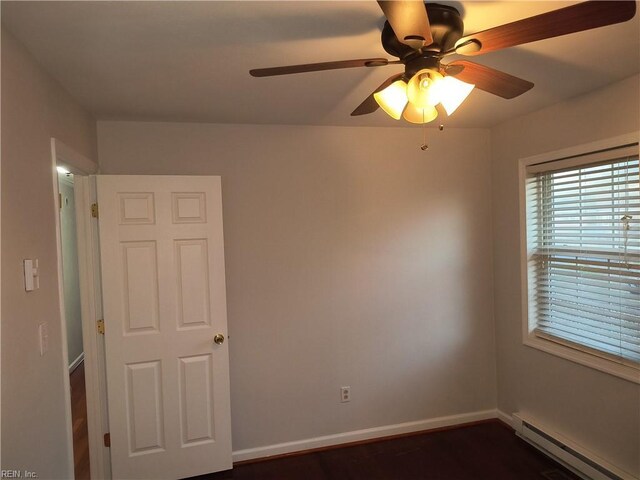 unfurnished room featuring a baseboard radiator and ceiling fan