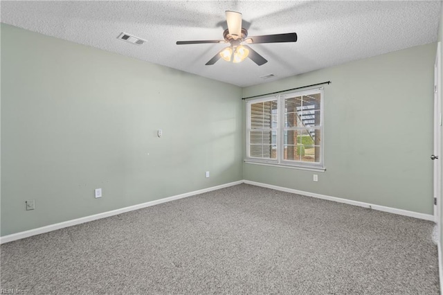 unfurnished room featuring ceiling fan, carpet floors, and a textured ceiling