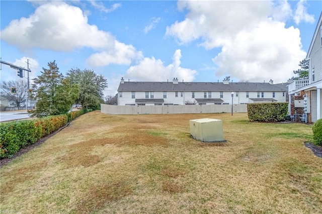 back of house featuring a yard