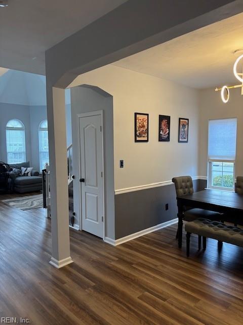 dining area featuring dark hardwood / wood-style floors, a chandelier, and a wealth of natural light