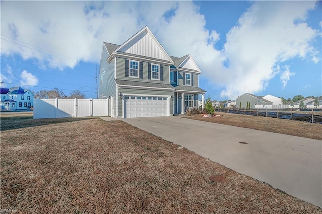 view of front of house featuring a garage and a front lawn