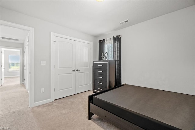 carpeted bedroom with a closet