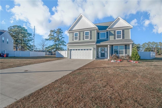 view of front of property with a garage and a front yard