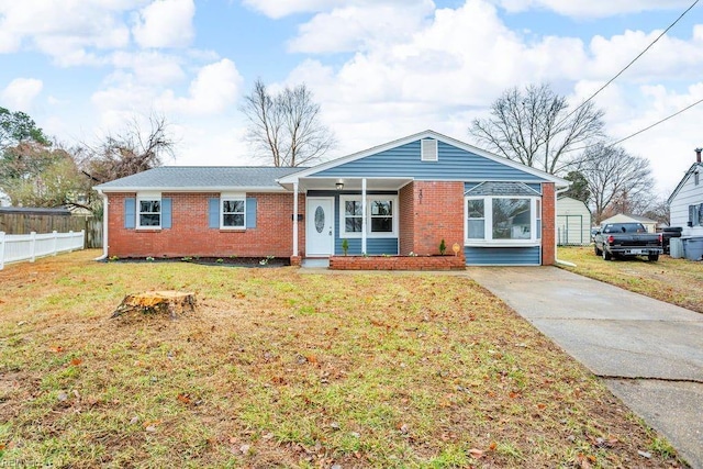 single story home with a front yard