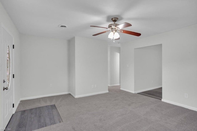 empty room featuring carpet and ceiling fan