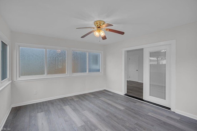 unfurnished sunroom with plenty of natural light and ceiling fan