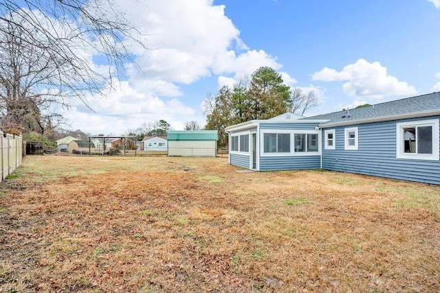 view of yard featuring a sunroom