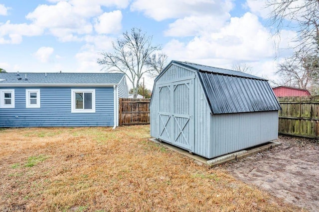 view of outbuilding featuring a yard