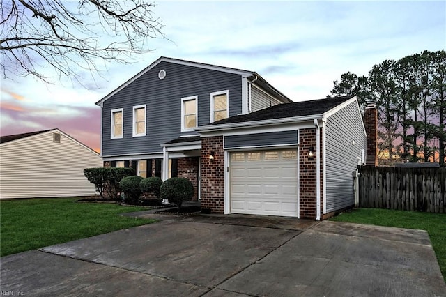 view of front property featuring a garage and a lawn