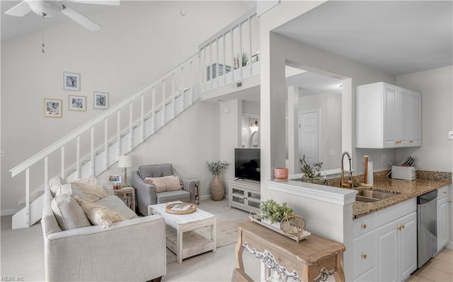 living room featuring sink and ceiling fan